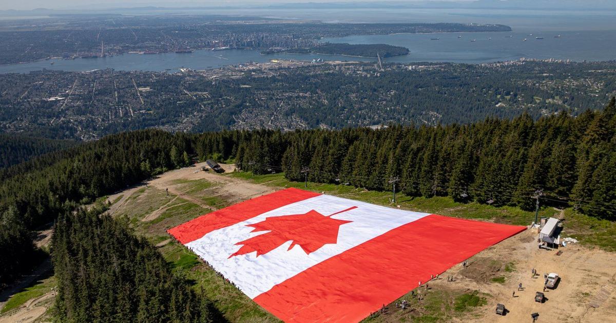 Giant Canadian flag unfurled on Grouse Mountain