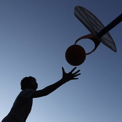 A photo of a boy playing basketball