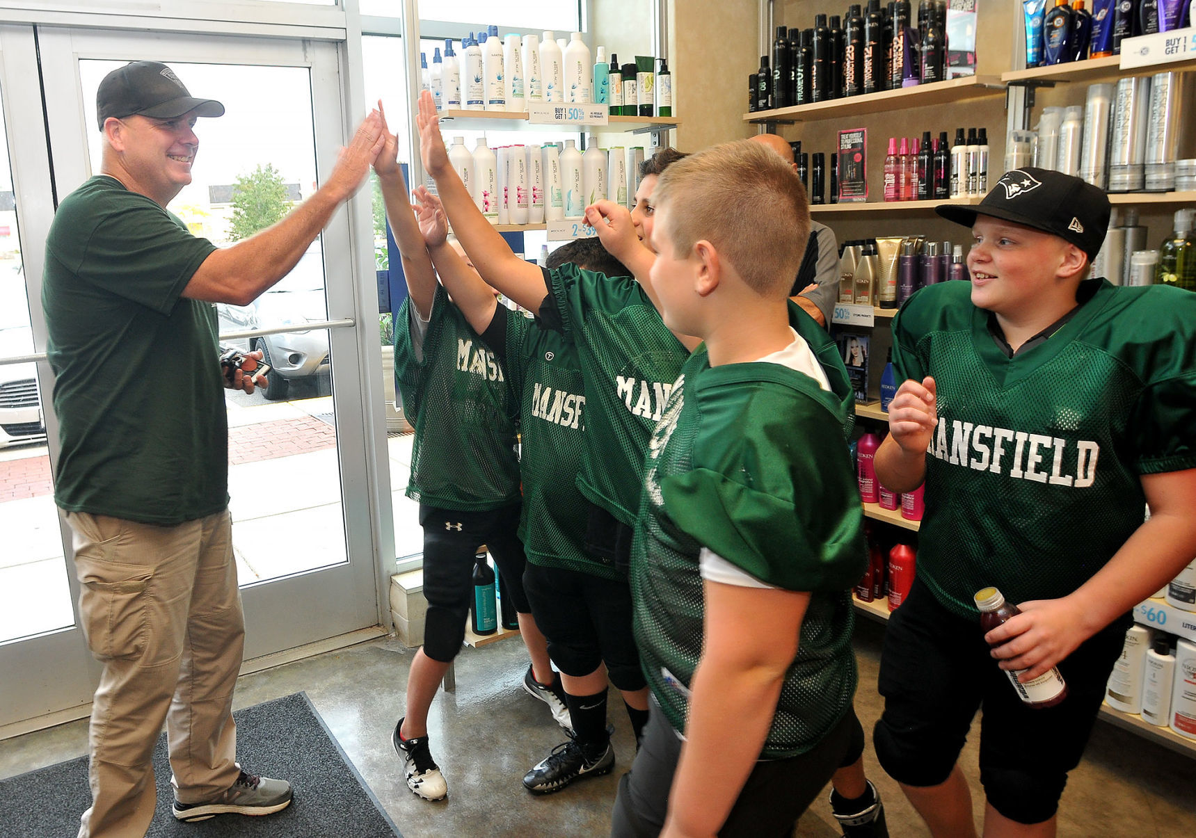 mansfield hair salon awards trooper coach for dedication and service supercuts hair salon