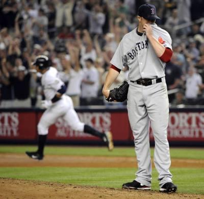 Boston Red Sox David Ortiz reacts while running the bases after he hits a  solo home run in the 4th inning against the New York Yankees at Yankee  Stadium in New York