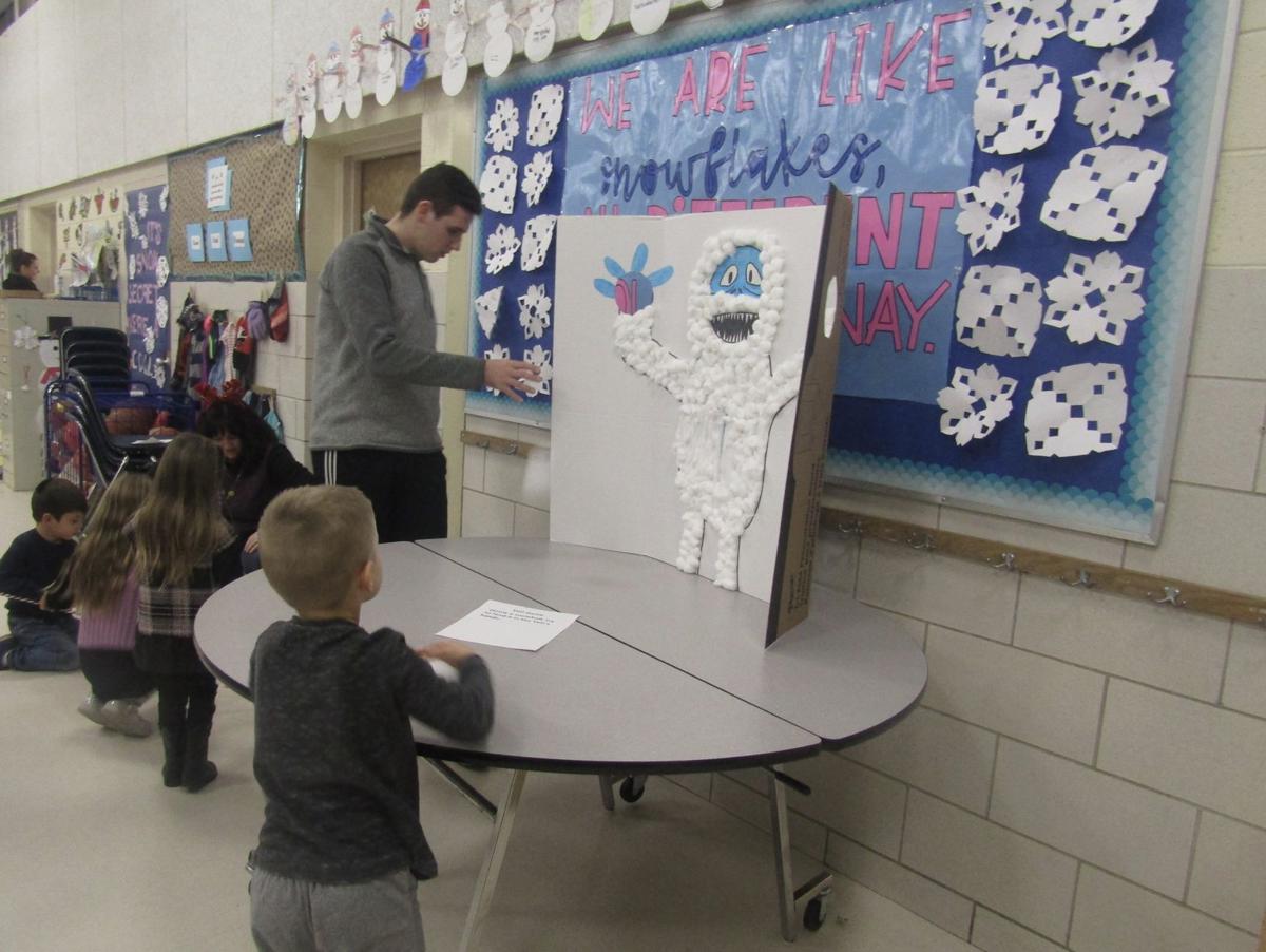 Winter social draws 100 families to Foxboro school ...