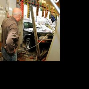 Driver charged after truck smashes into liquor store | Local News ...
