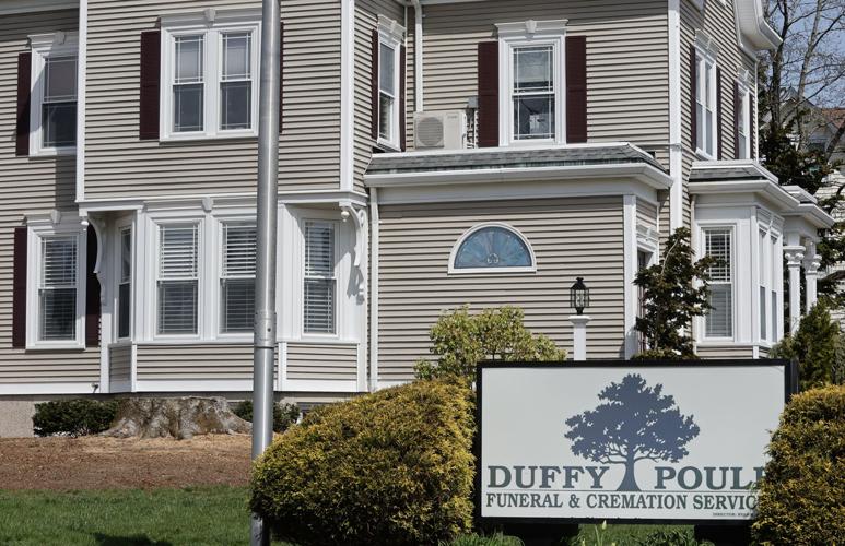 Copper beech tree in front of Attleboro funeral home was older than the