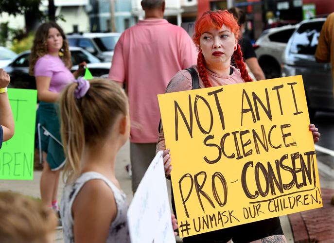 About two dozen protest in downtown Attleboro against mask mandate for ...
