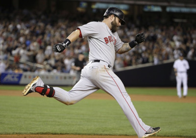 Yankees CC Sabathia throws a strike to Boston Red Sox short stop Xander  Bogaerts