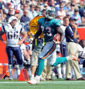 Miami Dolphins running back Ronnie Brown (23) runs in first