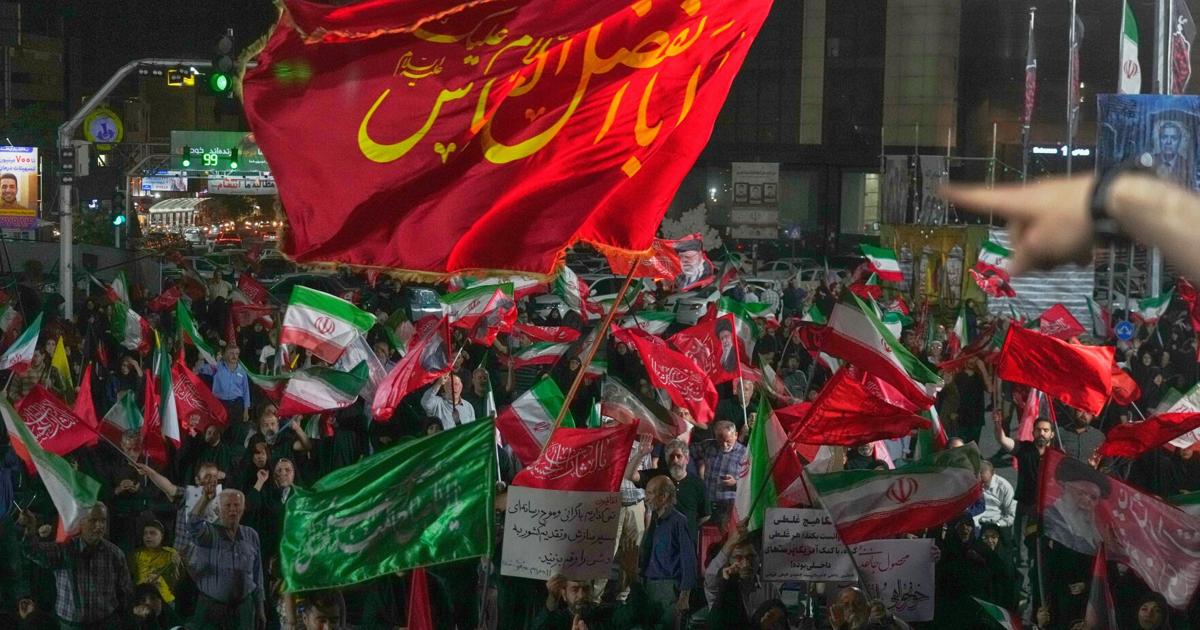 Iran says it is suspending commitments to interim deal with US as the two exchange attacks