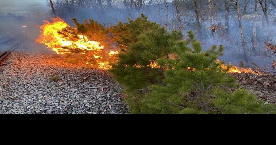 Area firefighters extinguish threeacre brush fire in Norfolk as dry