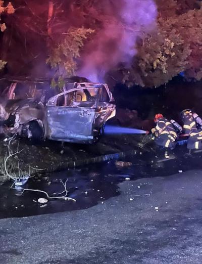 Driver escapes injury when car erupts in flames after hitting utility ...
