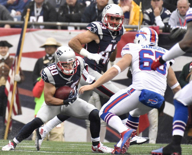 Buffalo Bills tackle Spencer Brown (79) walks off the field following a win  in an NFL football game against the New England Patriots, Sunday, Dec. 26,  2021, in Foxborough, Mass. (AP Photo/Stew