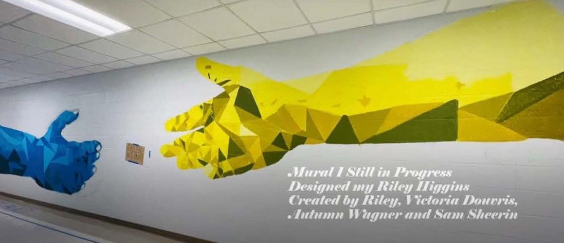 Art students painting high school hall walls with memorable murals ...
