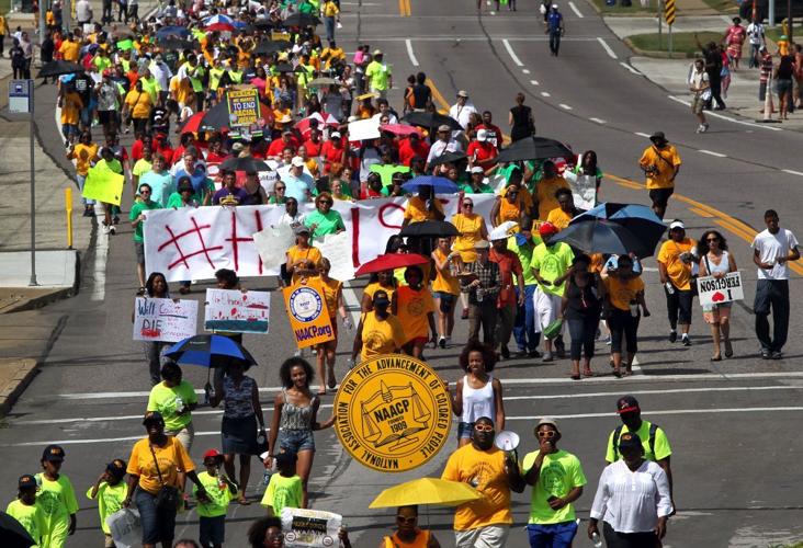 March marks two weeks since death of Michael Brown