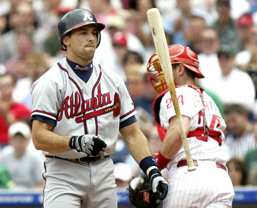 Atlanta Braves' Dan Uggla, right, bangs forearms with Chipper Jones after  Uggla's three-run home run against the San Diego Padres in the ninth inning  of the Braves' 10-1 victory in a baseball