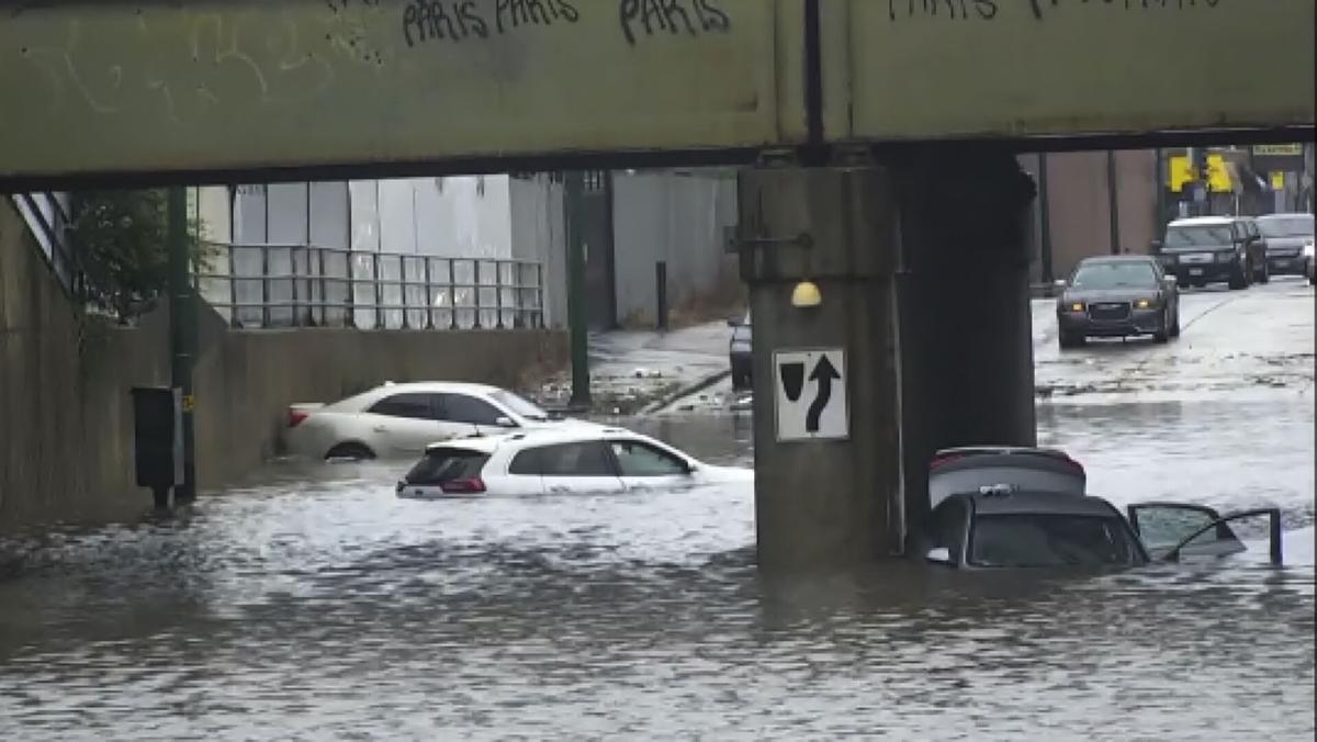 Heavy rains flood Chicago roads and force NASCAR to cut short a