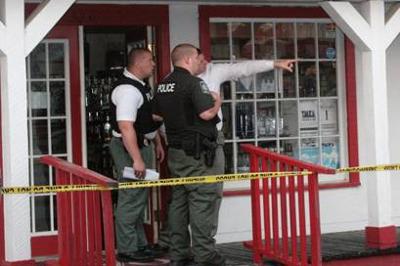 Two men sought in liquor store armed robbery