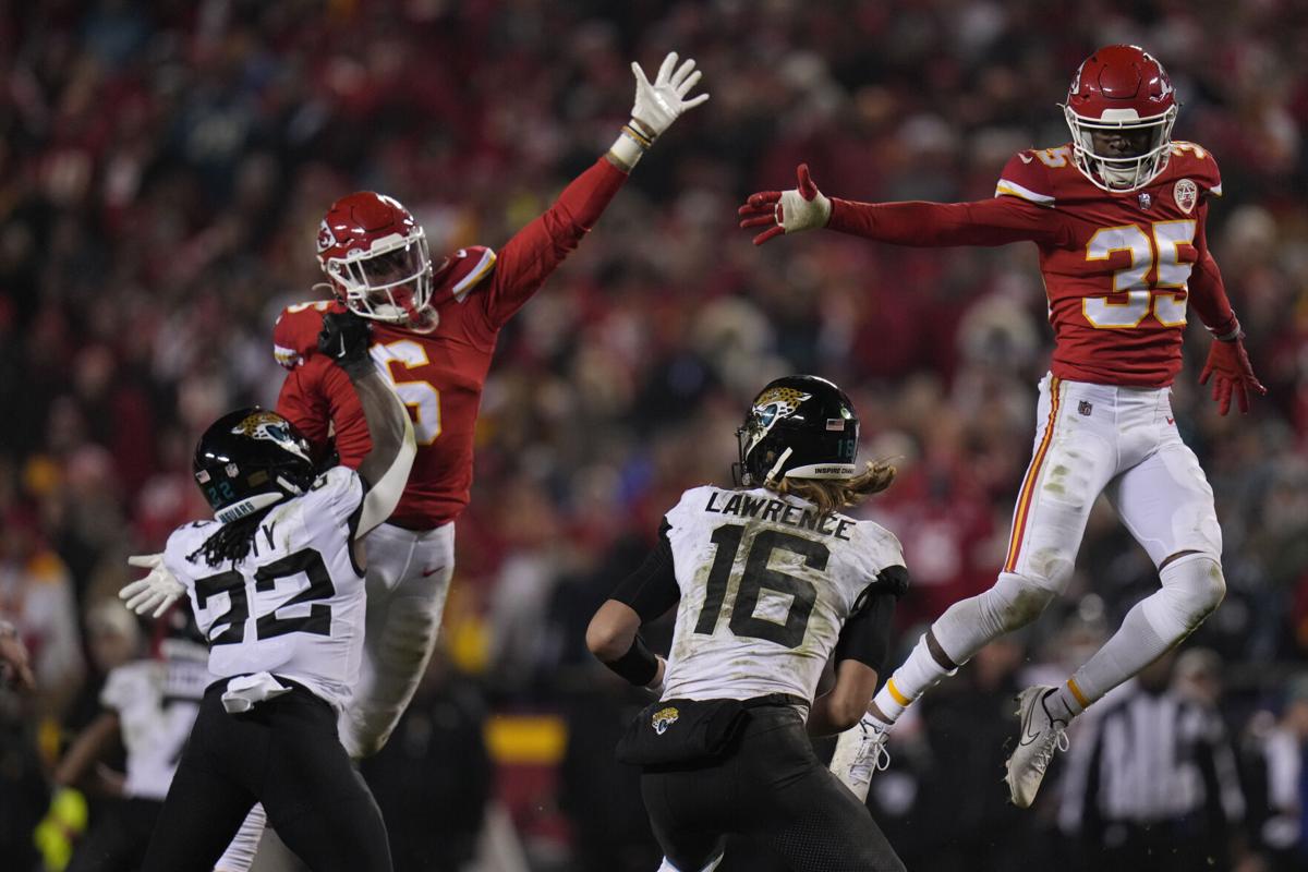 Kansas City Chiefs cornerback Jaylen Watson (35) celebrates an interception  against the Jacksonville Jaguars during an NFL Divisional Playoff football  game Saturday, Jan. 21, 2023, in Kansas City, Mo. (AP Photo/Ed Zurga