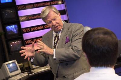 Joe Pinner in 2000, talking to an anchorman after a news program.