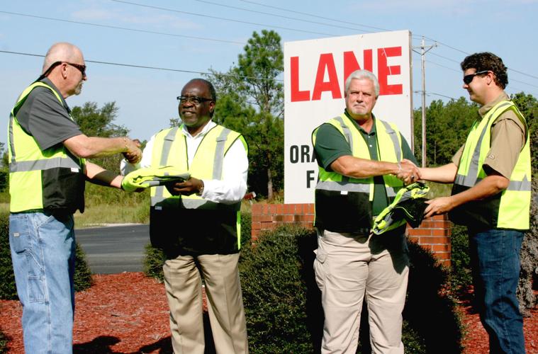 Businesses donate reflective vests for pedestrians