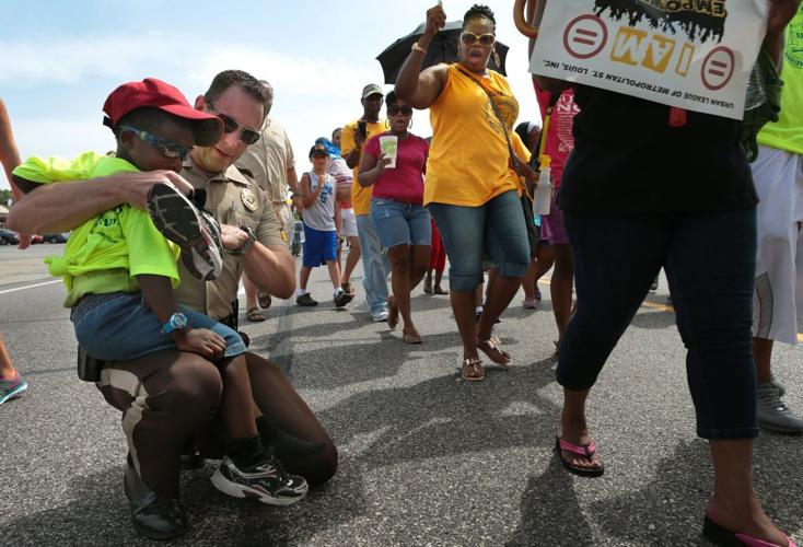 March marks two weeks since death of Michael Brown