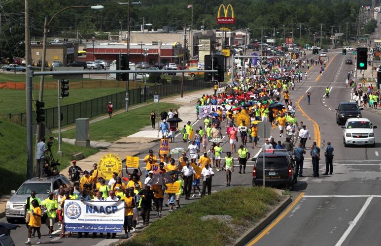 March marks two weeks since death of Michael Brown