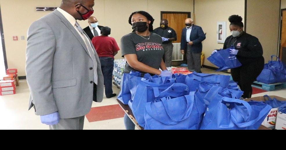 Volunteers pack care packages for quarantined students