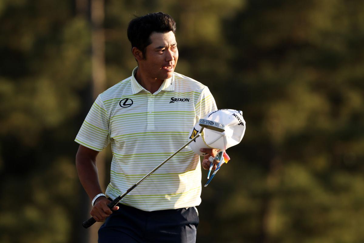 Hideki Matsuyama of Japan celebrates on the 18th green after winning the Masters at Augusta National Golf Club on April 11, 2021 in Augusta, Georgia.