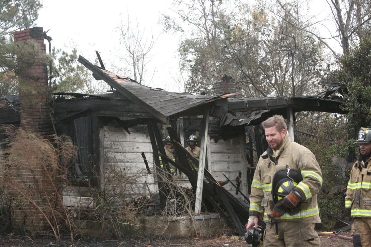 Trash fire causes damage