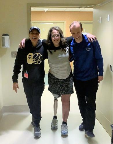 Dawn Staley helps woman who lost leg walk across court