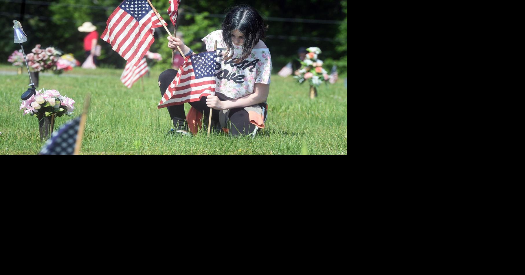 PHOTOS: Family groups place flags on veterans’ graves at Graham ...