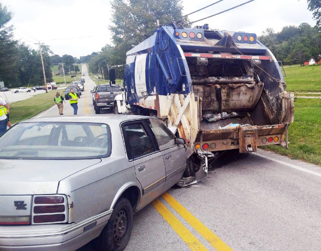 Three injured after car crashes into garbage truck | News