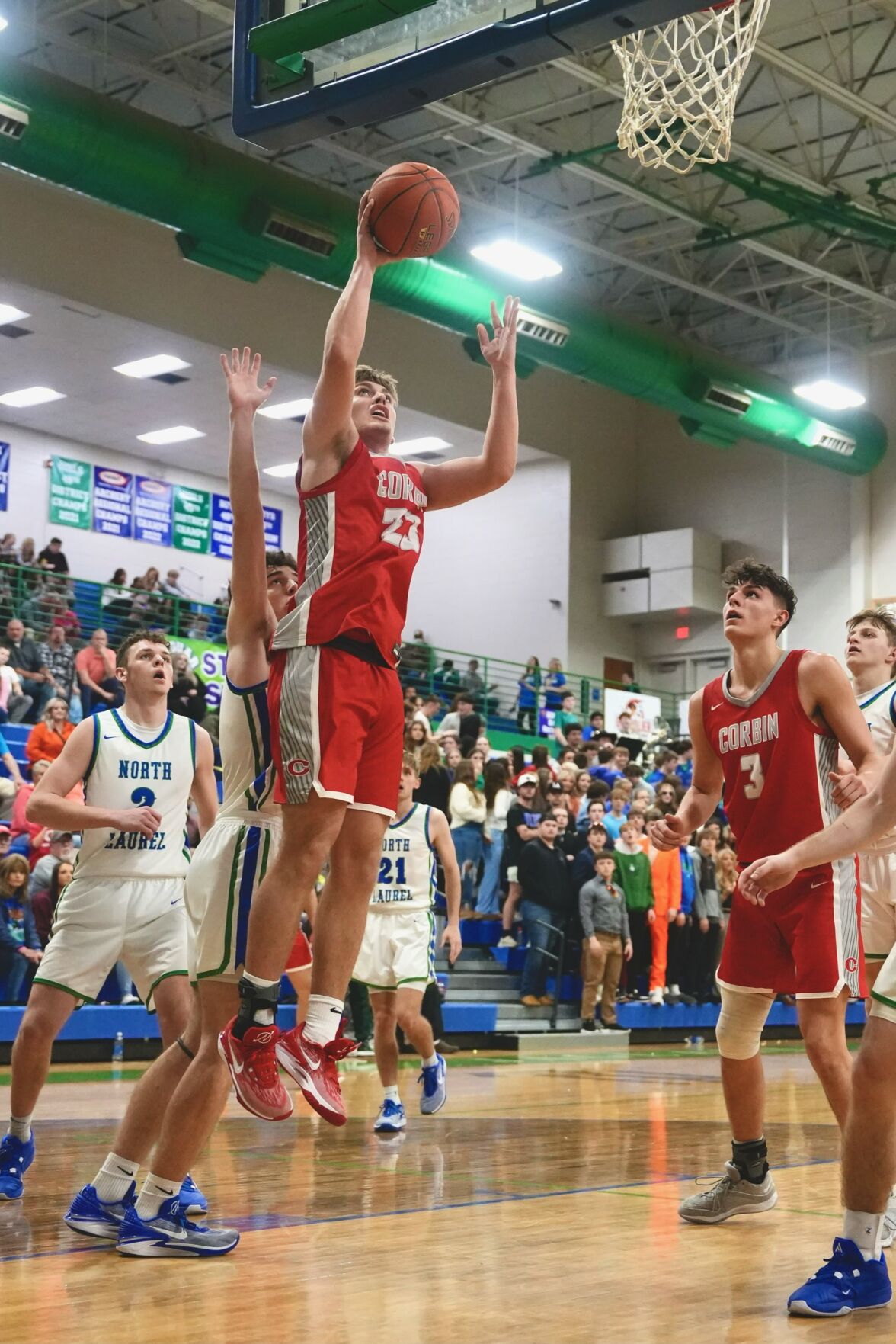 North Laurel Jaguars top Corbin Redhounds 75-71 in Double Overtime Thriller, Securing 11th Consecutive Victory
