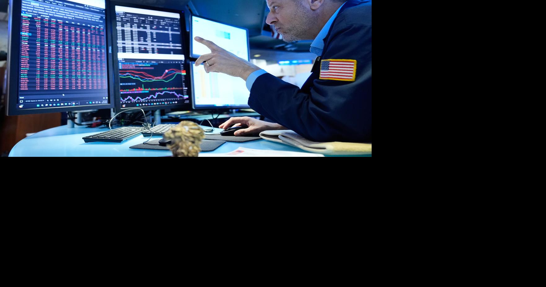 Wall Street holds steady after the Fed hikes interest rates as oil prices ease