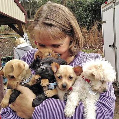 Melisa Gentry with puppies