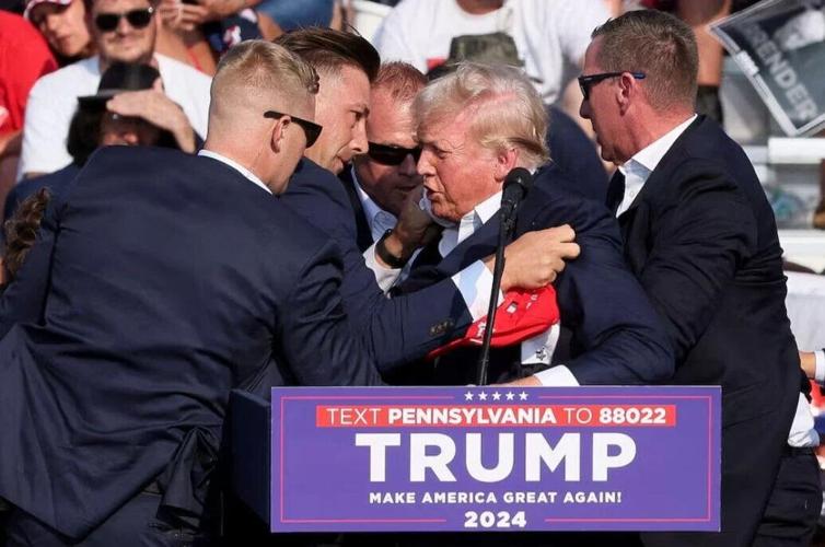 Multiple shots ring out at Trump rally, Trump seen injured, video shows