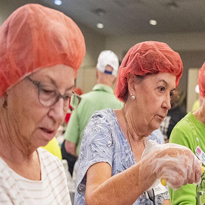 Chiefs players pack holiday meal boxes for families ahead of