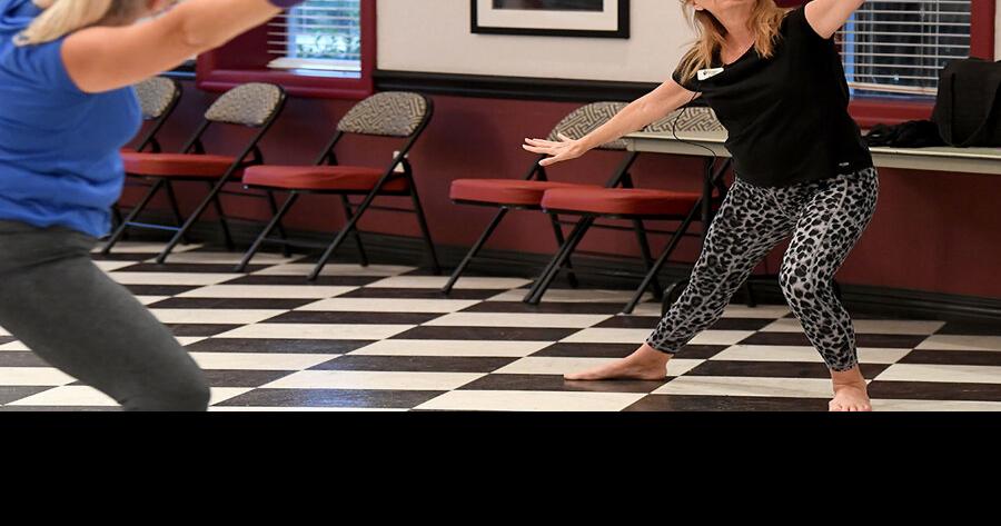 Yoga enthusiasts stretch to the beat