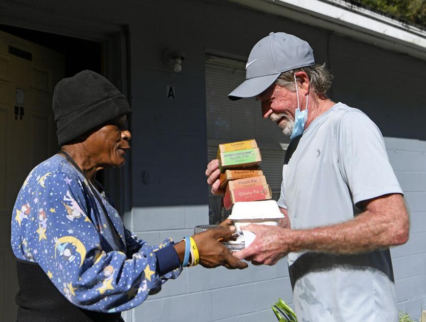 Volunteer brings food, conversation to families