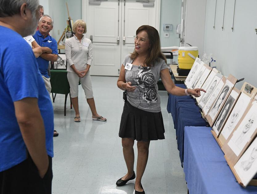 Enrichment Academy Instructor Lan Augustus is providing Villagers with her expert knowledge in creating art.