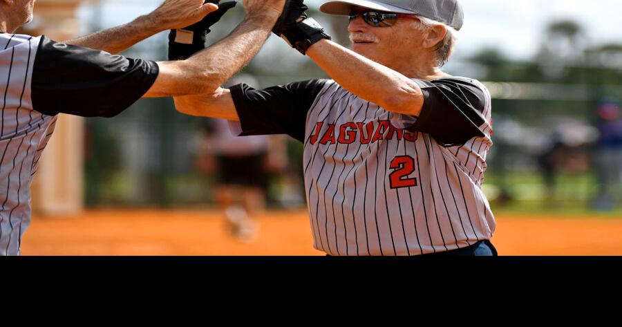 Softball players celebrate opening day