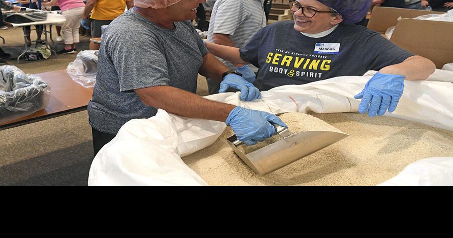 Villagers assist those in need at food packs