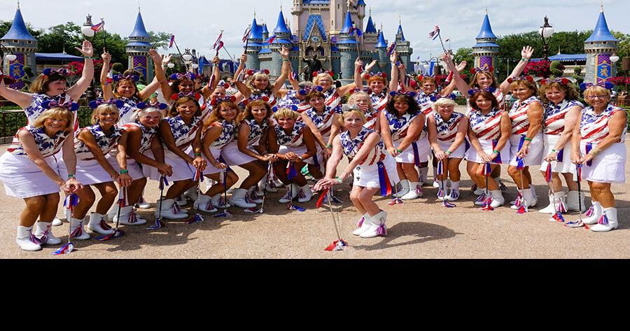 Village Twirlers perform in Magic Kingdom parade