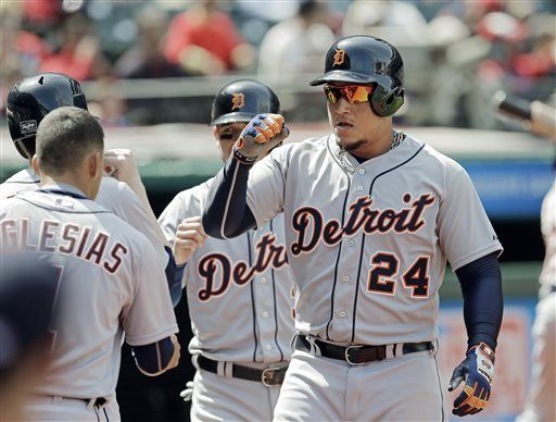 Seattle Mariners' Nelson Cruz is greeted in the dugout after he hit a  three-run home run in the first inning of a baseball game against the New  York Mets, Sunday, July 30