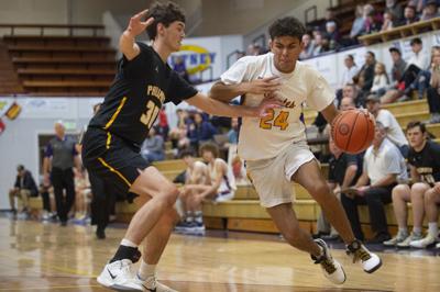 marshfield philomath plagued poor shooting loss boys theworldlink tournament schwab basketball les coast holiday south dylan montiel drives dom defends