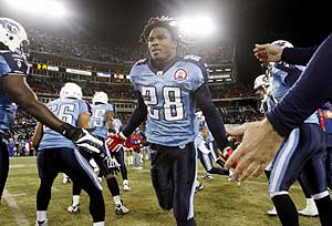 27 September 2009: Tennessee Titans running back #28 Chris Johnson pulls  out. The New York Jets defeated the Tennessee Titans 24-17 at Giants  Stadium in Rutherford, New Jersey. In honor of AFL