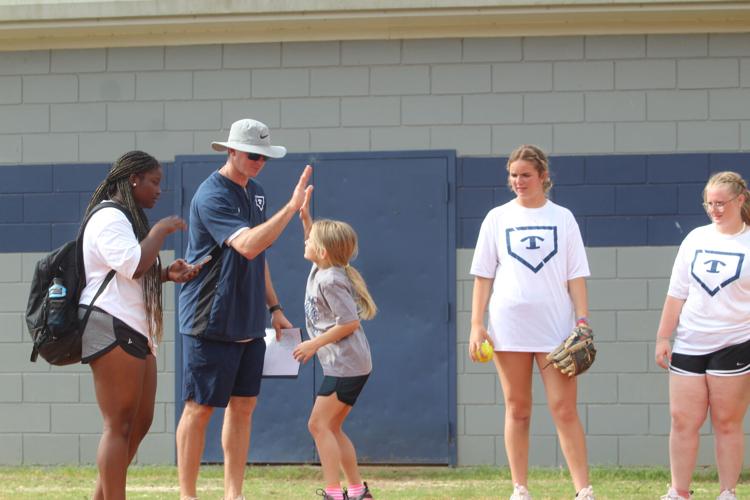 Square One children participate in a baseball & softball clinic