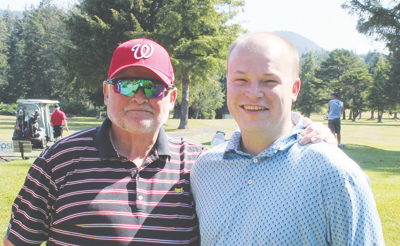 Kyle Beebehiser (right) stands with his father, Kevin Beebehiser