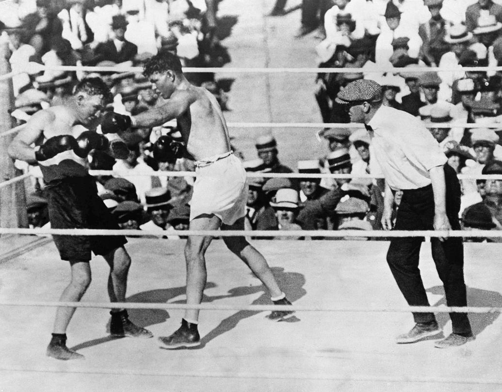 1919 and 1923: Jack Dempsey wins heavyweight title fights ...