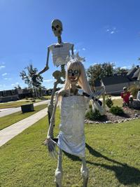 I covered my lawn in Taylor Swift Halloween decorations - there are  skeletons for every era, even Kelce makes a cameo