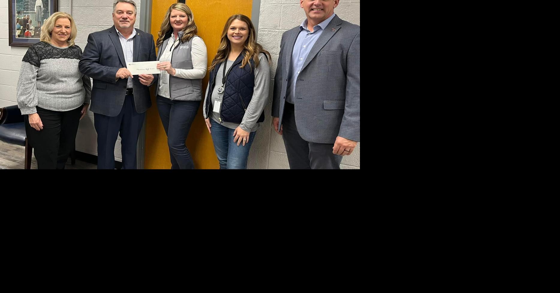 Ledbetter presents funds to Plainsview and Ider Special Services Center