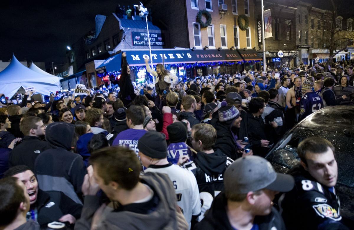 Fans mob Baltimore streets to celebrate Ravens win